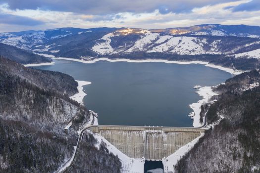Aerial view of energy dam, winter landscape at Bicaz Dam in Romania