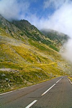 Alpine road in summer mountain. Summer morning in Fagaras mountains.