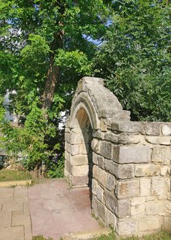 Stone gate in the wall of royal court of Piatra Neamt, Romania