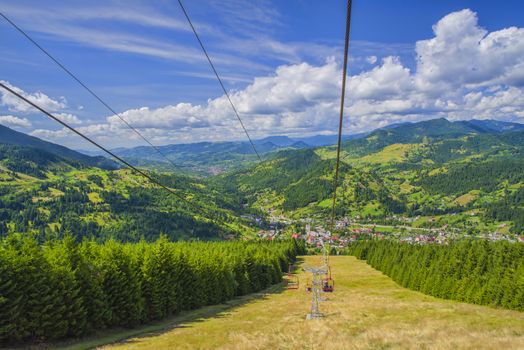 Chairlift ski transport in summer mountain landscape. Borsa is a well known winter sports resort in Romania