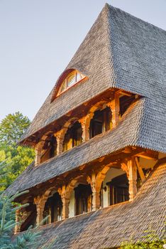 Traditional romanian architecture  in Maramures county, wwoden house at sunset.