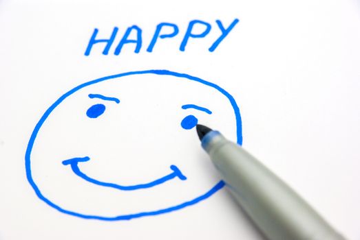 Marker drawing a happy face on paper