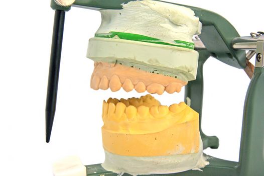 Mouth articulator model isolated over white, dentist laborator
