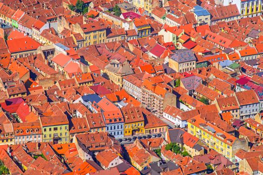 Aerial view of medieval city of Brasov in Romania, Ancient building roofs from above