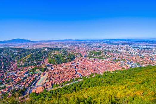 Panoramic view of Brasov city from the top, summer aerial scene in Romania