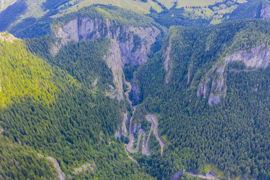 Summer aerial view of Bicaz Gorges and road in Romanian Carpathians.