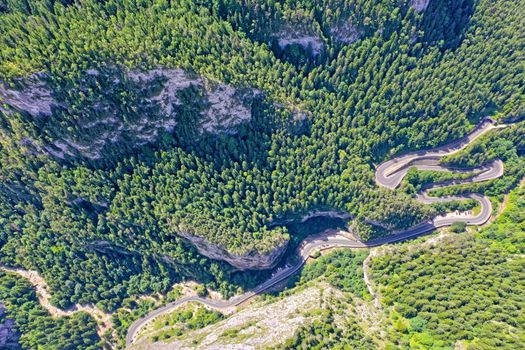 Rocky mountain and winding road, above view Bicaz Gorges in Romanian Carpathians.