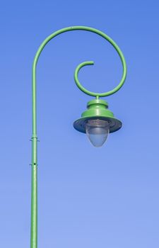 Street lamp on pillar with blue sky