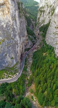 Rocky mountain pass in Romanian Carpathians, highway road near huge rocks