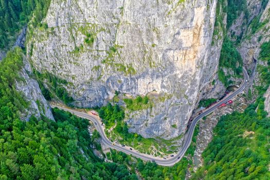 Rocky mountain pass in Romanian Carpathians, highway road near huge rocks