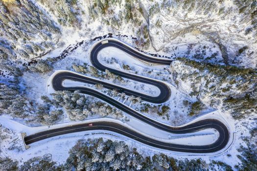 Winding road in rocky mountain and tunnel entrance. Bicaz gorge is a narrow pass between two historical Romanian region.