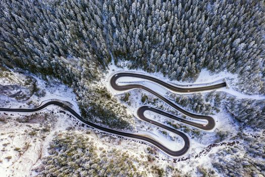 Winding road in rocky mountain and tunnel entrance. Bicaz gorge is a narrow pass between two historical Romanian region.