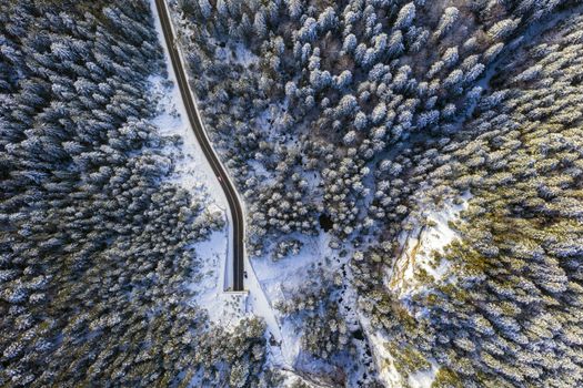 Winter road in tunnel entrance. Bicaz gorge is a narrow pass between two historical Romanian region.