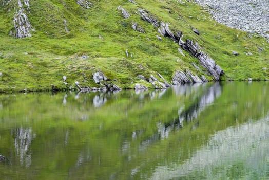 Mirror rocky mountain, summer scene in Romanian Carpathians.