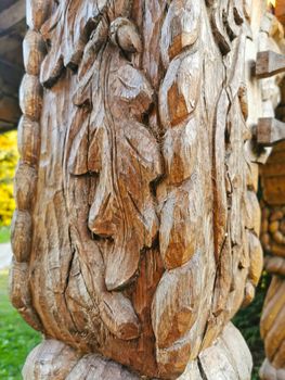 Close image of wooden pillar sculpture In north Romania