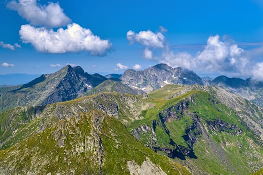 Green and rocky mountain in beautiful summer day. Fagaras Mountains in Romania