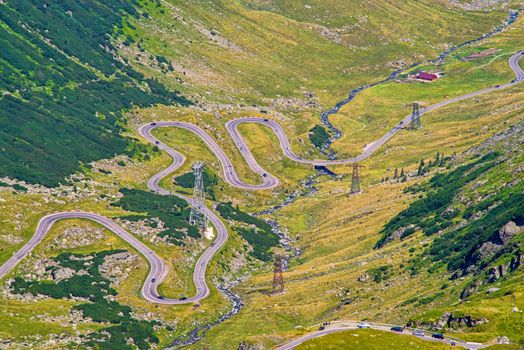 Curvy road seen from above, summer landscape in Fagaras Mountains, Romania, Transfagarasan road