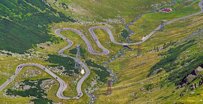 Winding summer road seen from above, Transfagarasan road in Romanian Capathians.