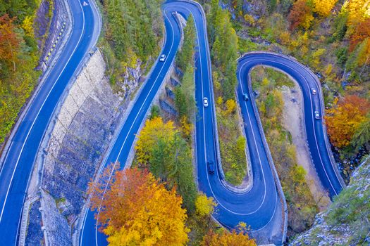 Autumn serpentine road in Romanian Carpathians. Bicaz Gorges are a mountain pass between two historic region in Romania.