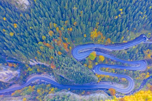 Above view of curvy mountain road in Romanian Carpathians. Bicaz Gorges are a mountain pass between two historic region in Romania.