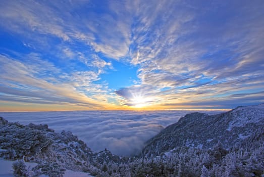Winter sunrise scene from the mountain top in Romanian Carpathians.