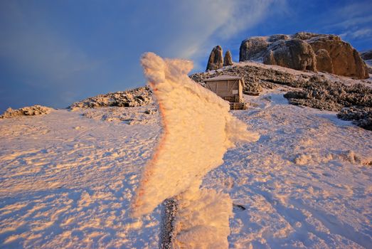 Romanian Carpathians frozen signpost, snowy indicator on the mountain