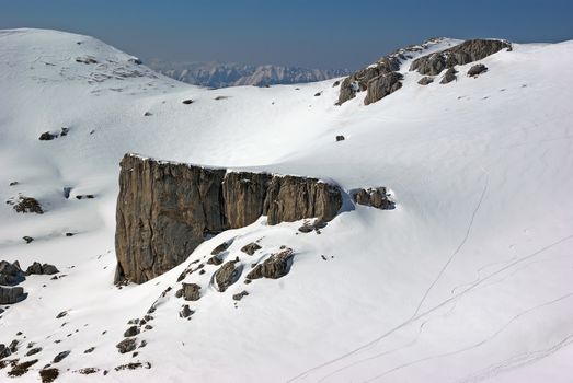 Winter mountain landscape, rock mountain covered by snow in alpine area, Romanian Carpathians