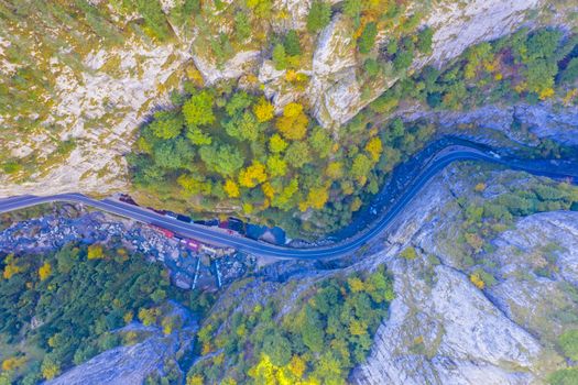 Gorges mountain road in autumn viewed from above.This stunning gorge has a part that is so narrow that it is called "The neck of Hell". The road is a passageway between Romanian provinces Moldova and Transylvania.