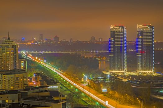 Aerial night city scene in Kiev, modern buildings landscape
