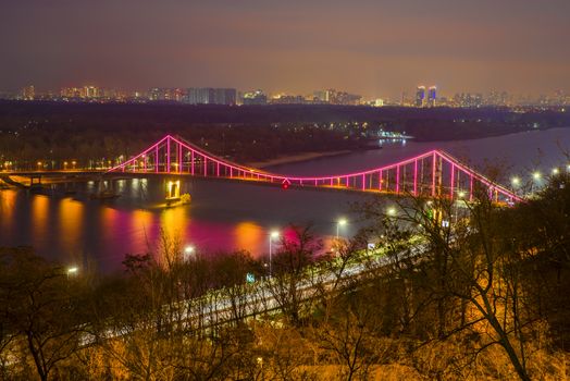 Night landscape of Patona Bridge over Dnieper River in Kiev