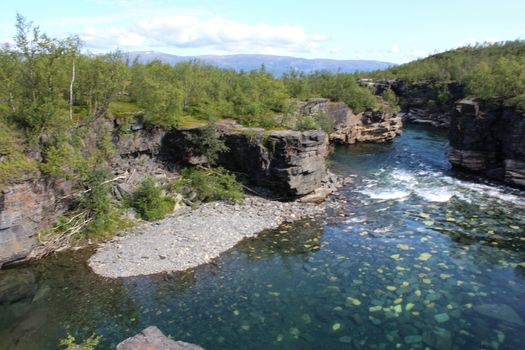 Overview of Kungsleden river in the arctic tundra. Abisko national park, Nothern Sweden