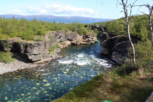 Overview of Kungsleden river in the arctic tundra. Abisko national park, Nothern Sweden