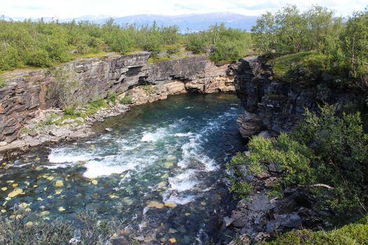 Overview of Kungsleden river in the arctic tundra. Abisko national park, Nothern Sweden