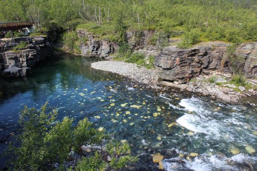 Overview of Kungsleden river in the arctic tundra. Abisko national park, Nothern Sweden