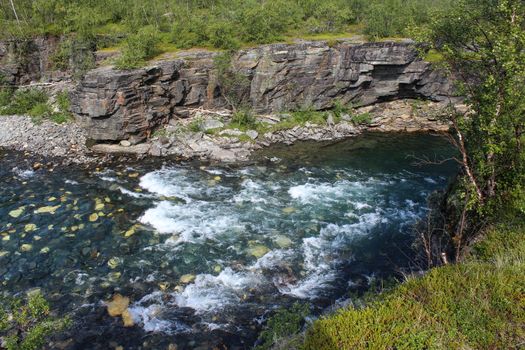 Overview of Kungsleden river in the arctic tundra. Abisko national park, Nothern Sweden