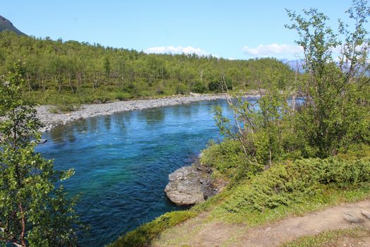 Overview of Kungsleden river in the arctic tundra. Abisko national park, Nothern Sweden