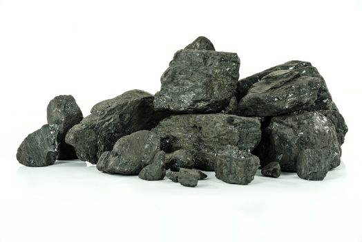 Concept of energy fuel - black coal in close-up isolated on a white background