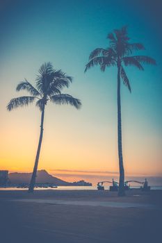 Retro Style Sunrise Over Waikiki Beach In Hawaii With Palm Trees