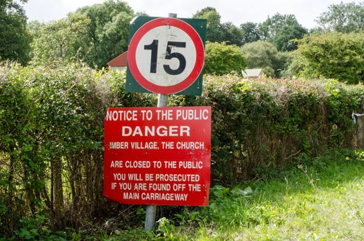 Warning sign in Imber village, Wiltshire.  The area is in the middle of the Salisbury Plain military training area and public access is restricted. 