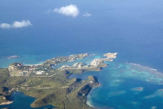 Aerial view of the Devil's Bridge National Park, Dian Bay, Pineapple Beach Club and Long Bay on the North East coast of Antigua in the Caribbean Sea.  