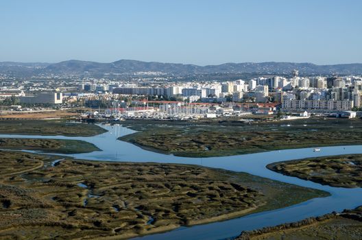 Aerial view of the salt marsh between Faro City centre and the Atlantic Ocean on the Algarve coast of Portugal.