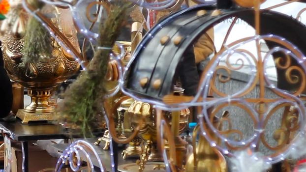 many brilliant metal samovars at the celebration of the city holiday.
