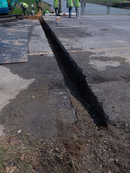 installing concrete drains on the side of the road