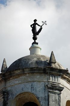 The iconic bronze sculpture of La Giraldilla weather vane on top of the Castillo de la Real Fuerza in Havana, Cuba.