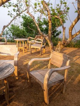 table and chairs standing on a lawn at the garden