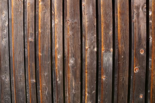 Decorative panel from wooden boards on a house wall