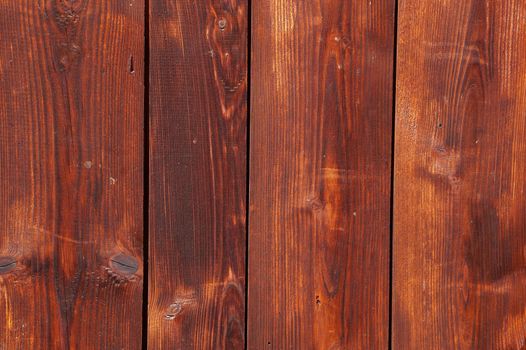 Decorative panel from wooden boards on a house wall