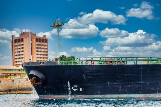 A massive tanker ship leaving the harbor on Curacao