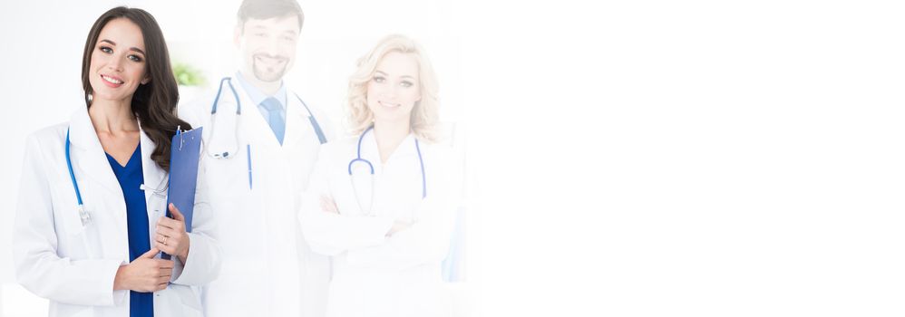 A medical team of doctors, men and woman, isolated on white background with copy space