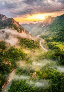 Montenegro,mountains and of sunset sky over world famous tara river. Canyon near city Zabljak